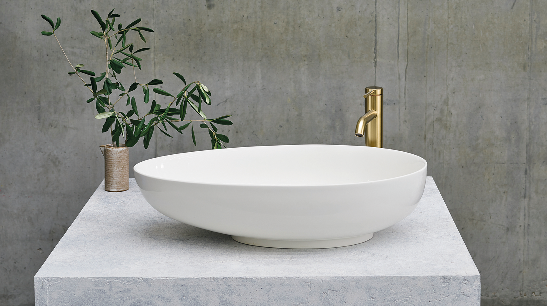 Luxury Bathroom Ideas | Create a nod to the stone bathroom trend with a stone basin for your luxury contemporary bathroom suite